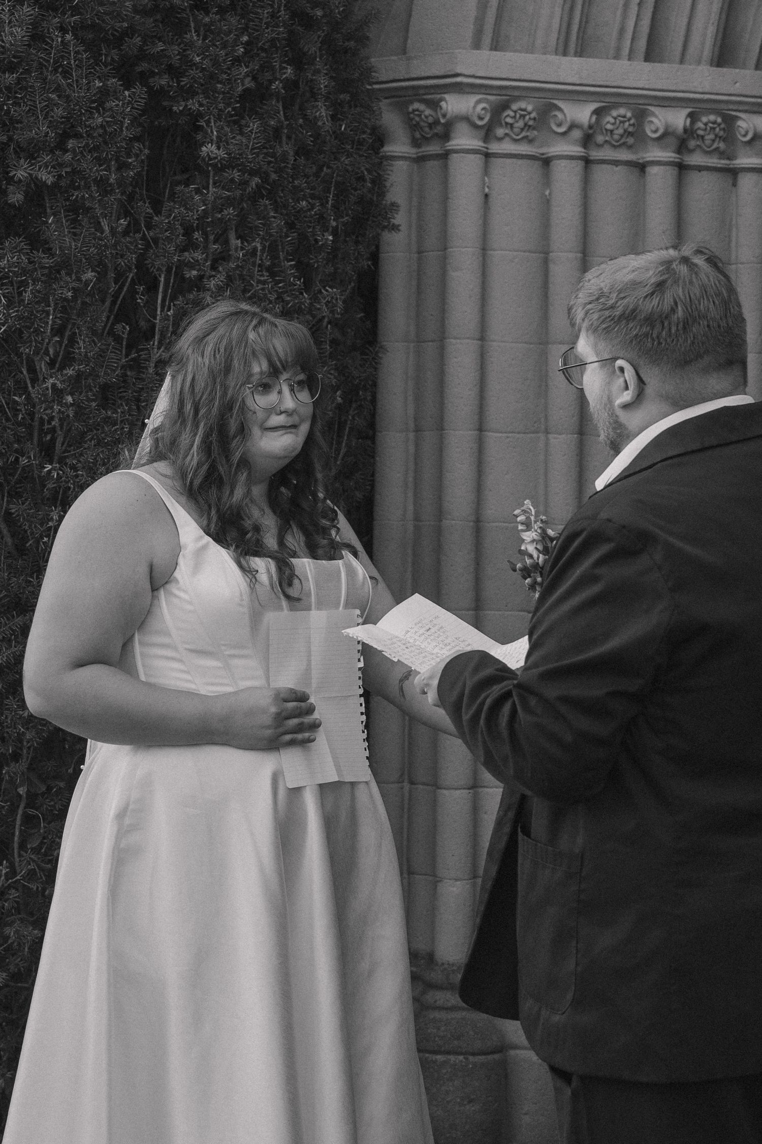 Candid documentary style photography capturing true emotions and moments in black and white of bride in tears on elopement day.