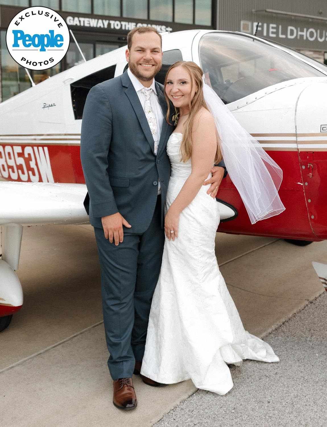 Nina and Jacob on their wedding day as featured in People Magazine standing in front of plane.