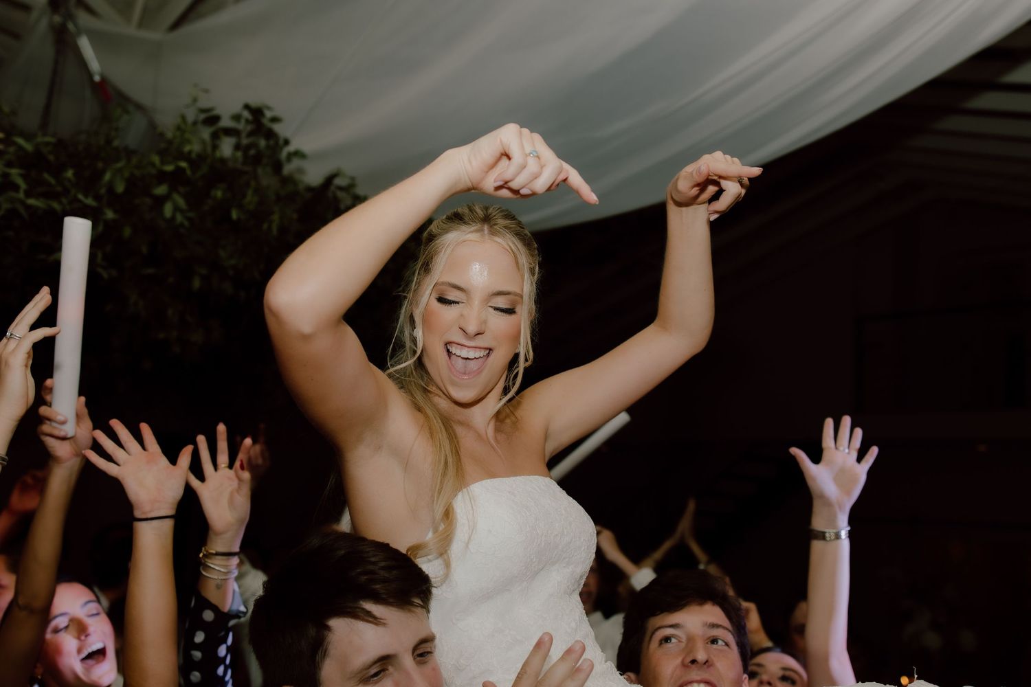 Wedding reception photography fun, candid moment, documented in true to color fashion at wedding venue, The Loft at Stone Oak by Malachi.