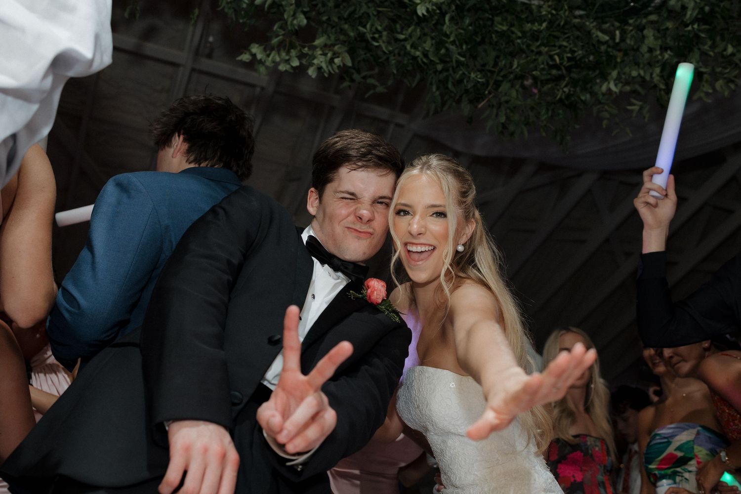 Fun dance floor photo showcasing bride have a good time.