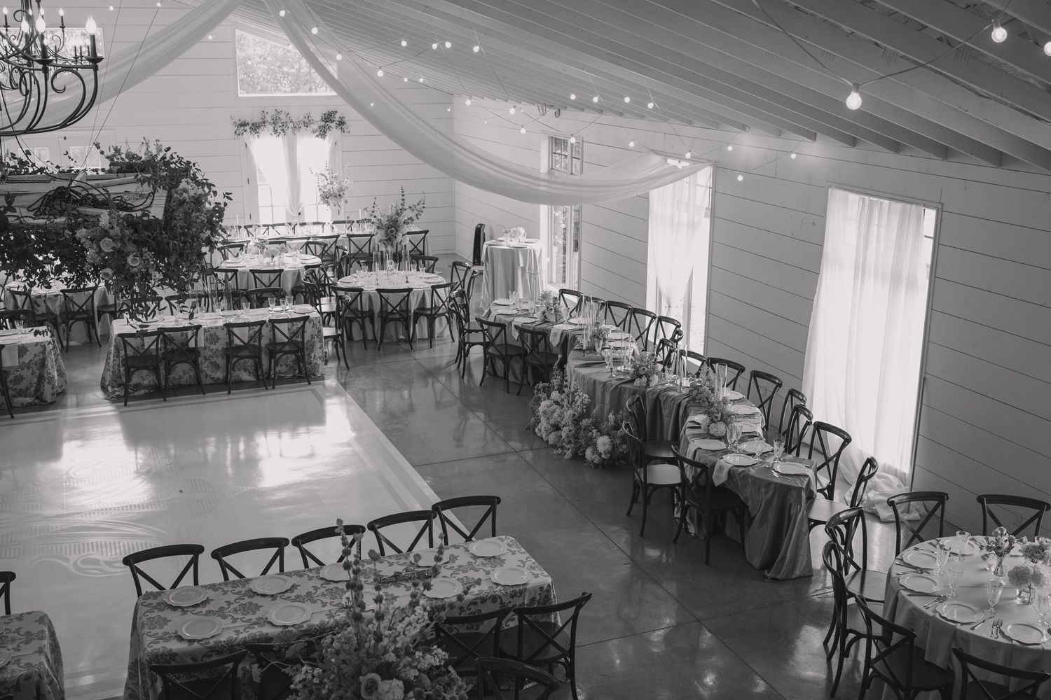 Overview of The Loft at Stone Oak venue in black and white featuring the reception floor plan and dance floor for elegant, timeless wedding.