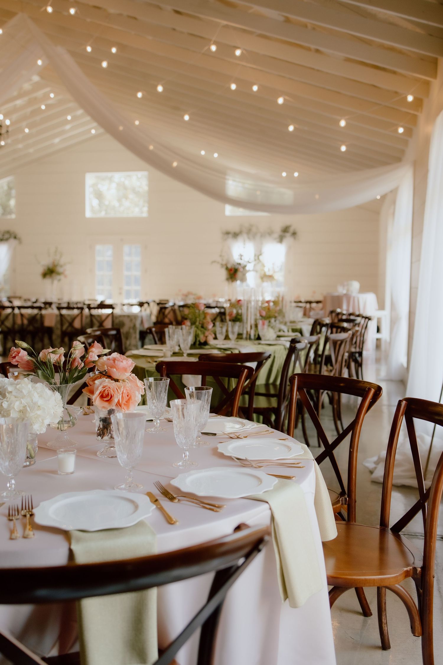 Warm, timeless, classic wedding reception venue, The Loft at Stone Oak in Greenwood Arkansas, decorated in peach and green tones for Summer.