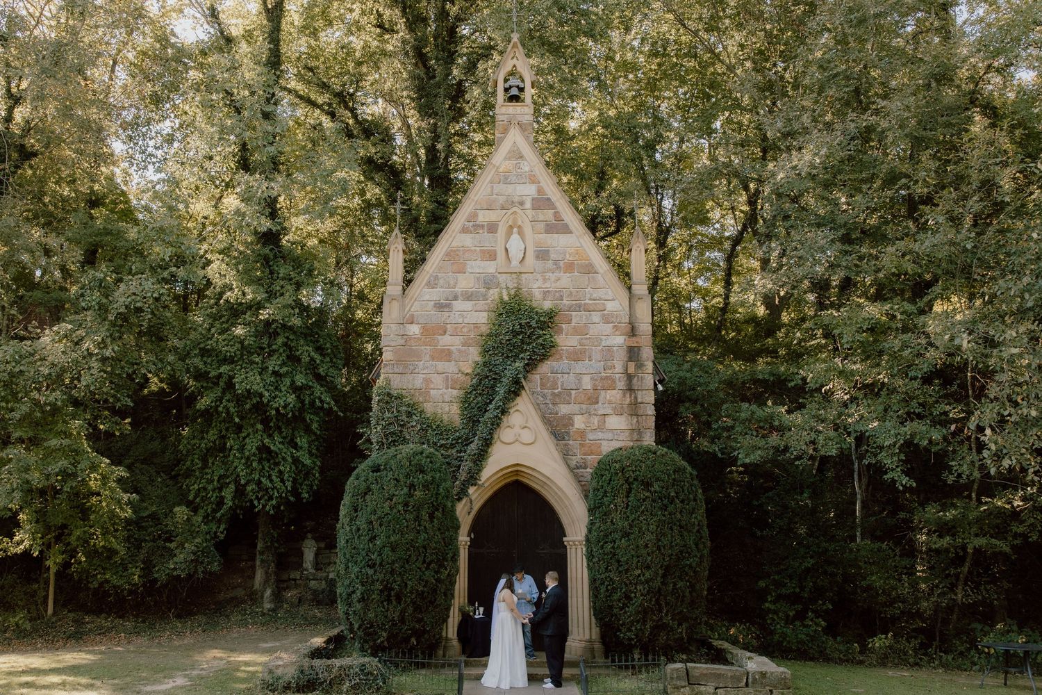 A wide shot view of the St. Catherine's at Bell Gable wedding venue in Fayetteville, Arkansas during outdoor elopement ceremony.