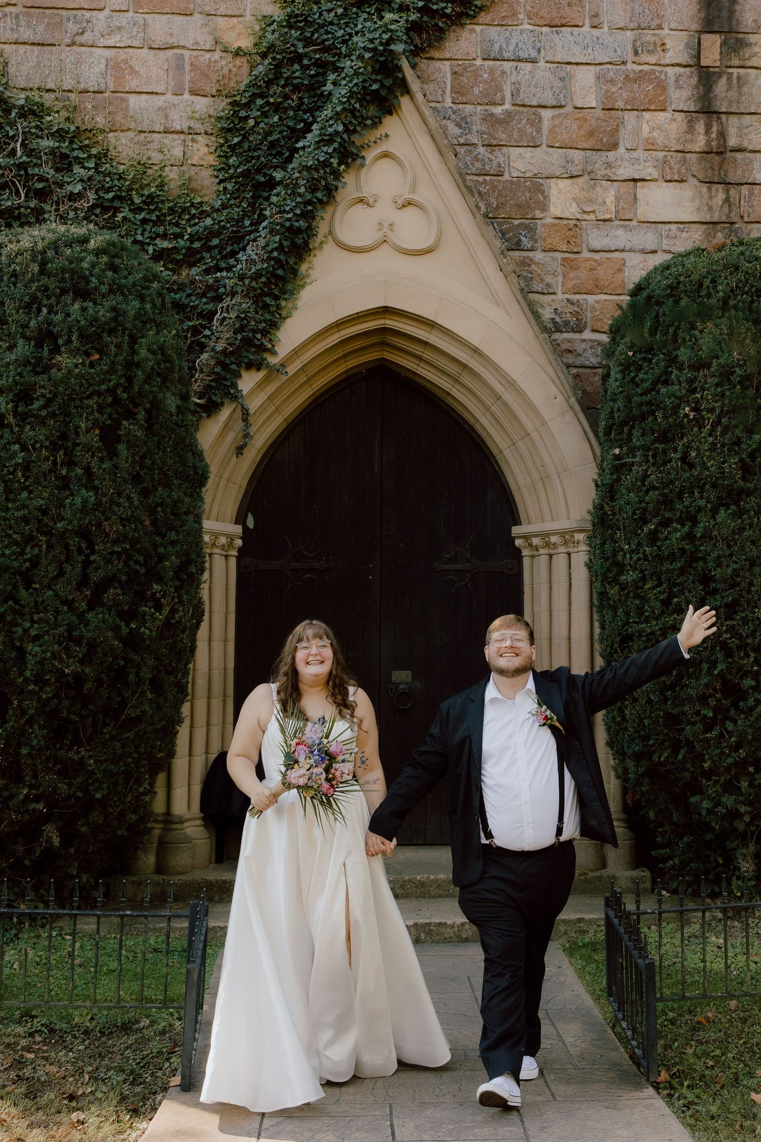 Joyful moment after the couple's wedding ceremony of the two of them celebrating their new elopement at St Catherine's Bell Gable.