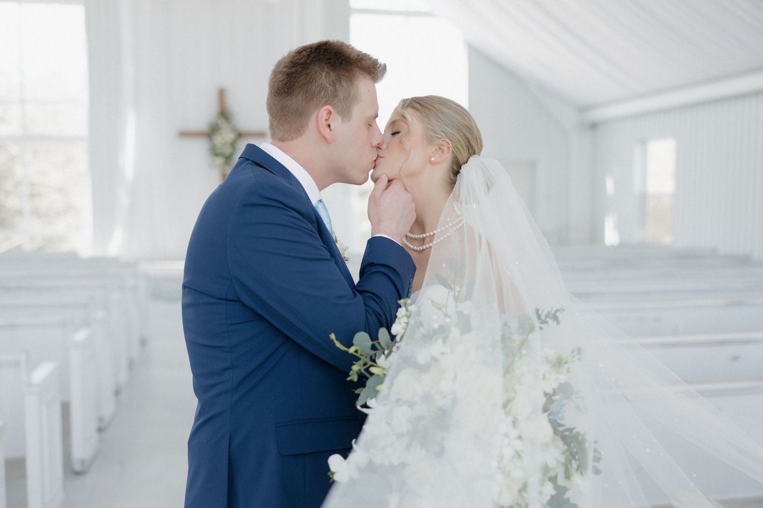 Bride and groom sharing a quiet inside the chapel at Cold Springs Events venue