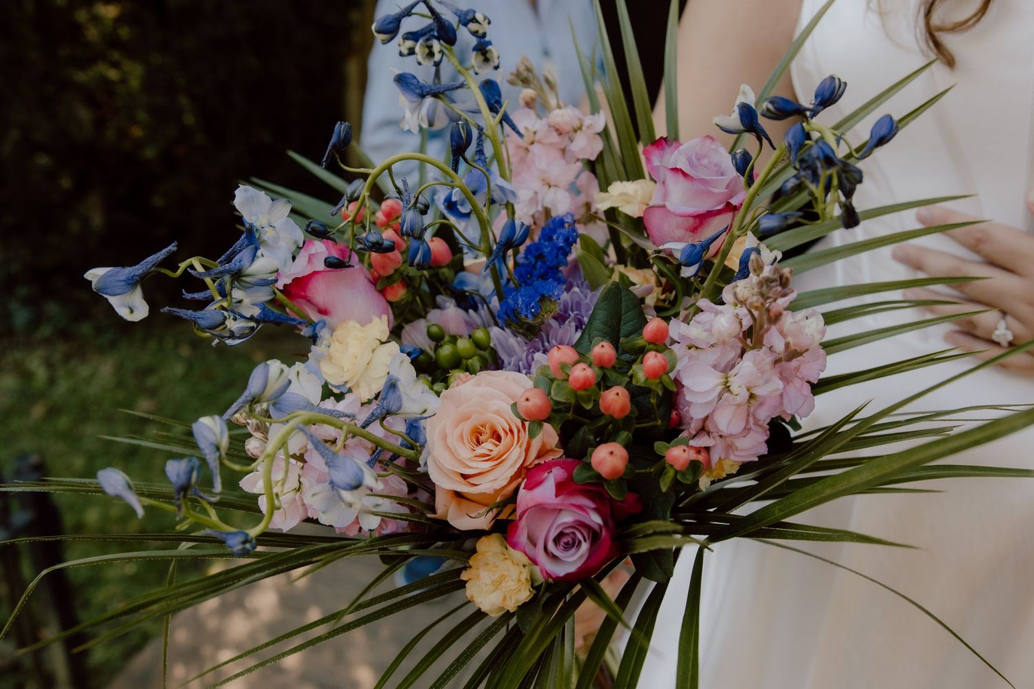 Bridal bouquet with pinks, corals, blues, and other colorful pops perfect for brides who love true to color and bright colorful photos.
