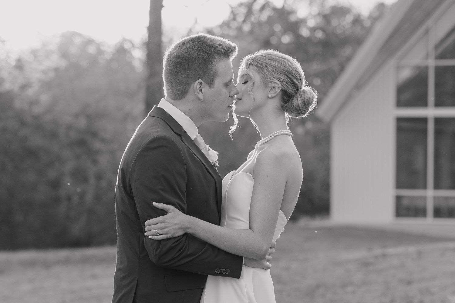 Natural light wedding photo of couple on dock at Cold Springs Events near Little Rock