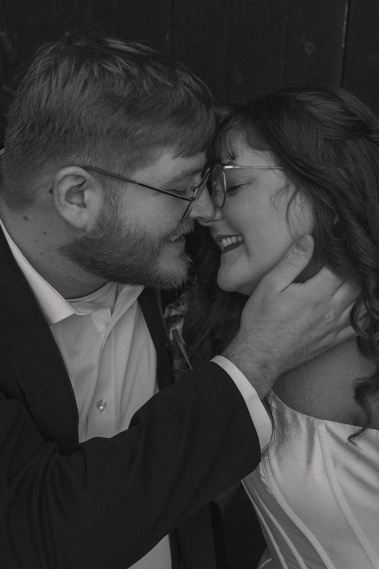 Romantic, intimate wedding photography moment captured of bride and groom touching noses in a pose that you can feel the moment.