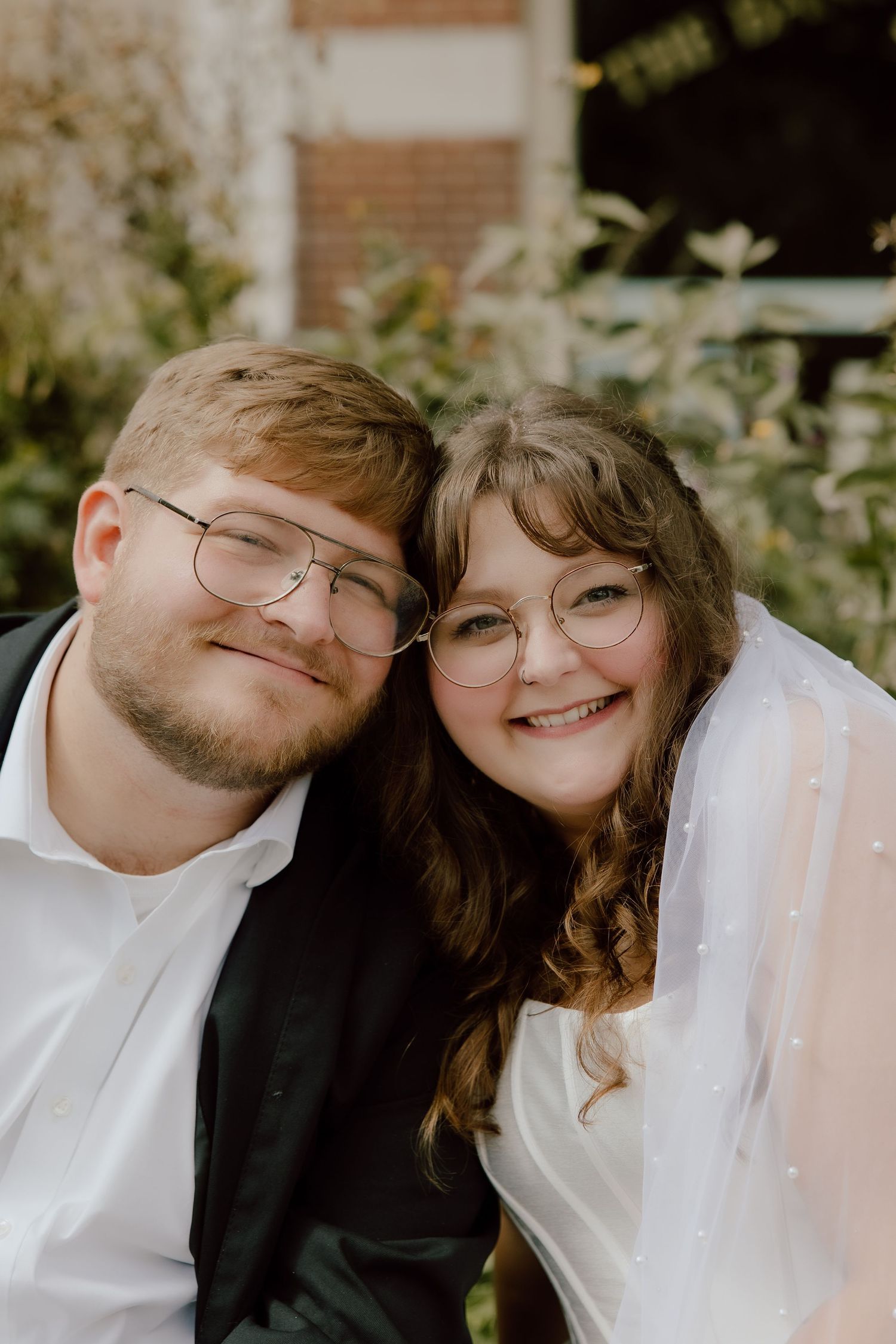 Smiling formal bride and groom wedding day portrait on a sunny outdoor summer elopement day in Arkansas.