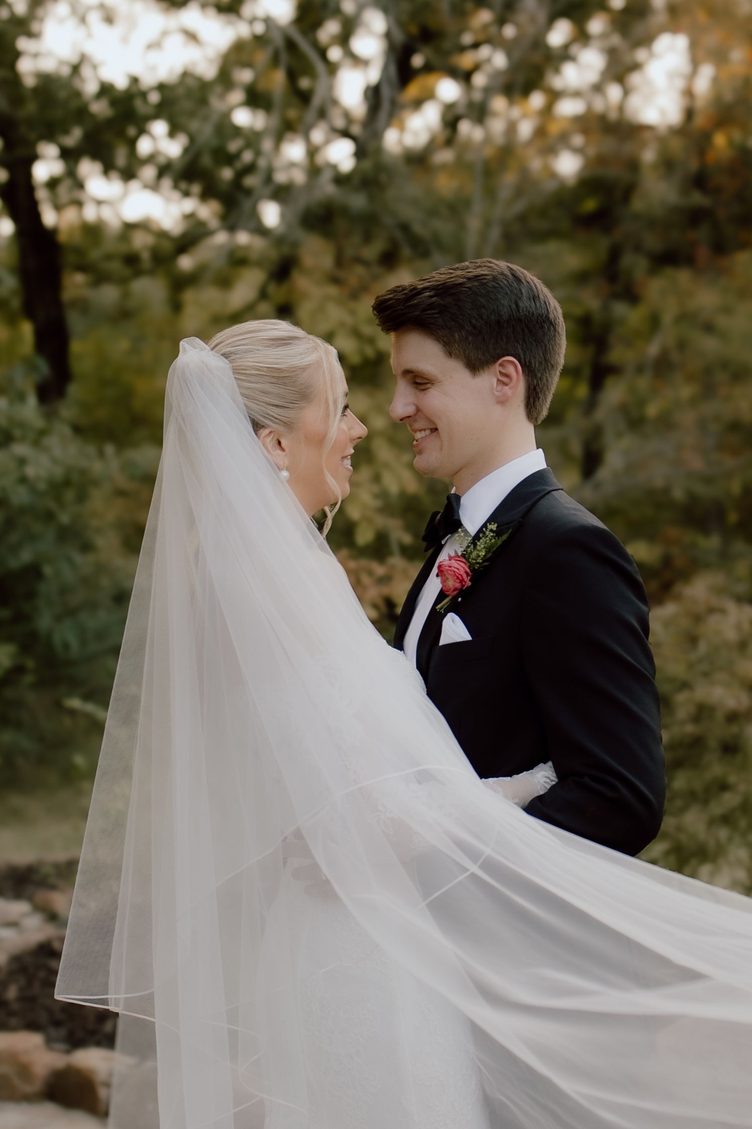 Arkansas bride and groom golden hour veil shot taken at The Loft at Stone Oak during timeless, classic Summer wedding, by Malachi Westbrook.