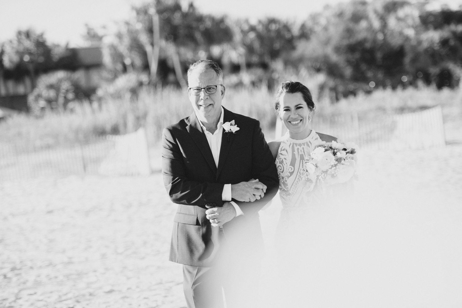 Black and white outdoor portraits captured in natural setting with soft lighting.
