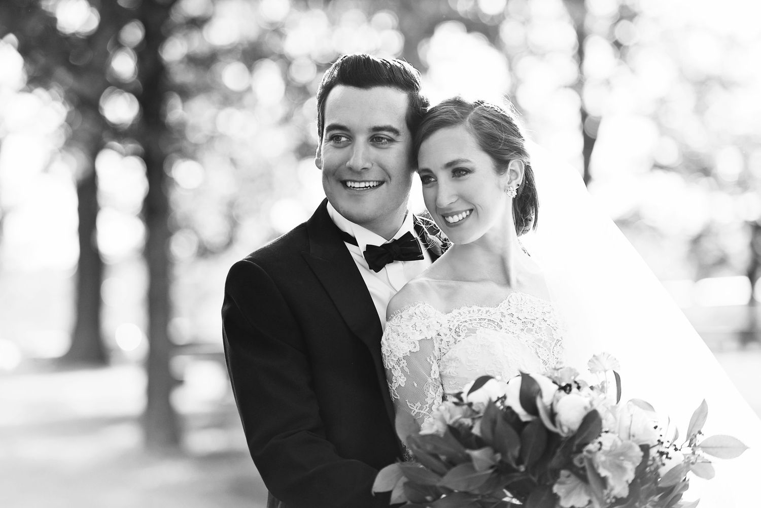 A black and white wedding portrait captured outdoors among trees. Columbus, Ohio Wedding.