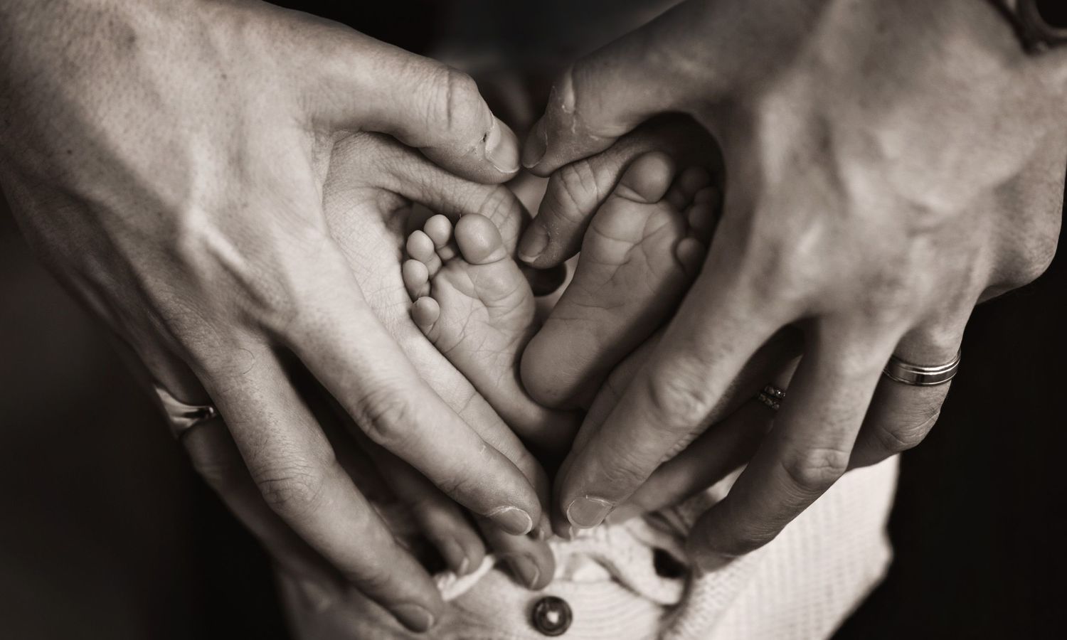 Black and white artistic close-up photo series showing hands gently intertwined in various intimate poses.