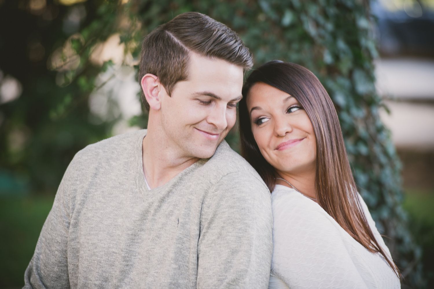Engagement session Intimate portrait of couple sharing sweet moment against natural backdrop.