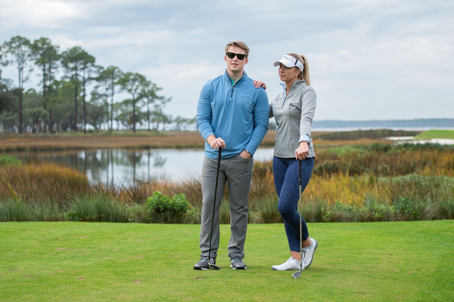 Golfers standing together on seaside golf course with pine trees in background. Sea Pines Hilton Head. Southern Tide Brand editorial photosh