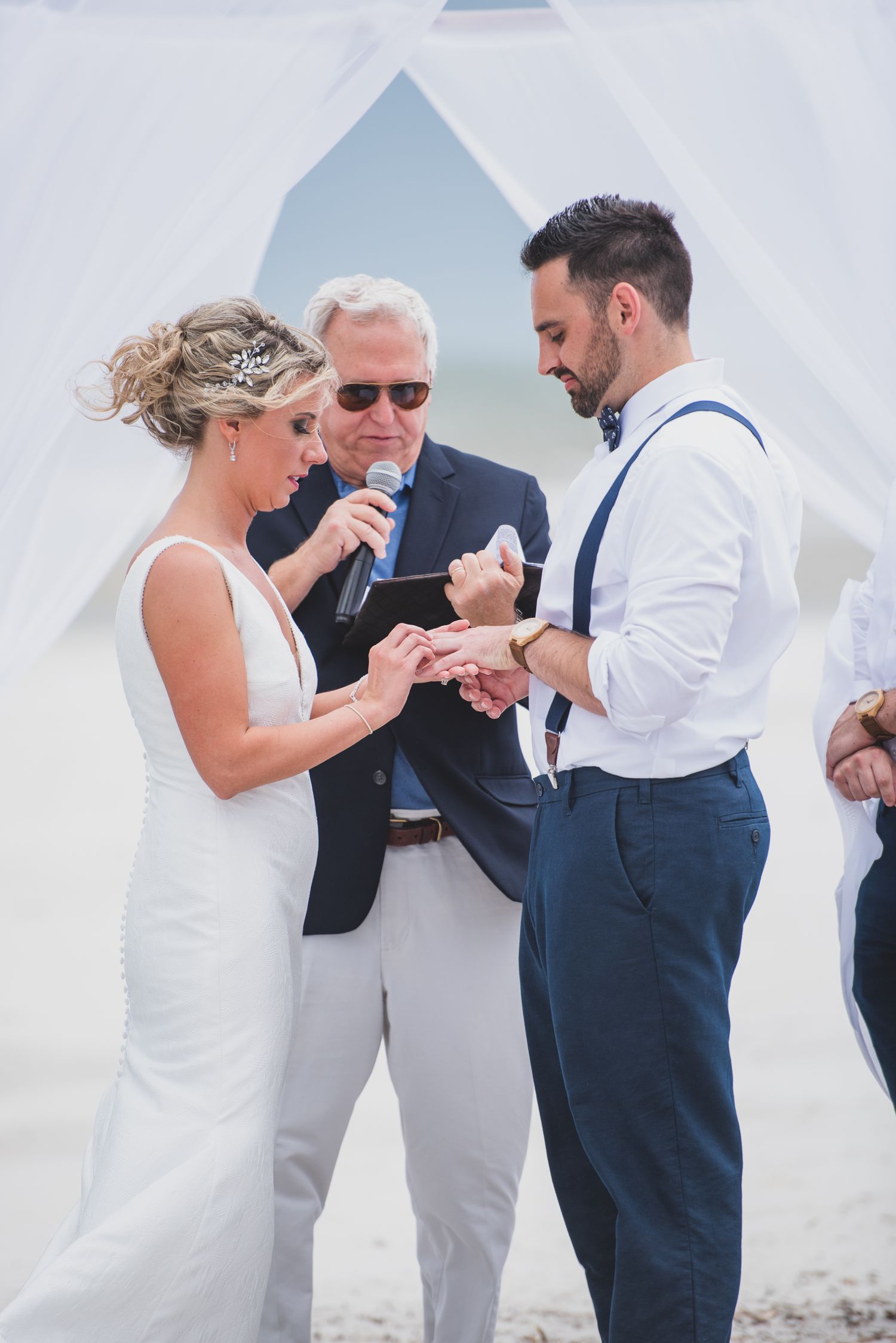 Hilton Head Wedding ceremony sequence showing ring exchange under white fabric canopy on beach.