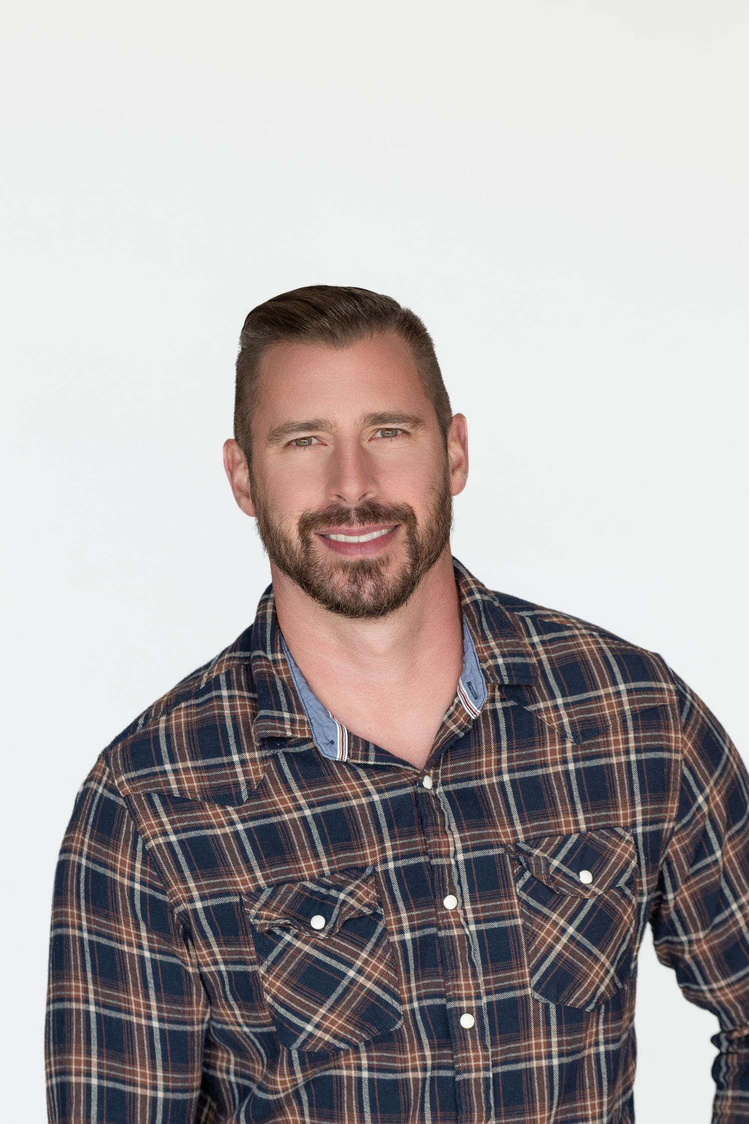 Professional headshots of someone wearing a plaid button-up shirt against white background.