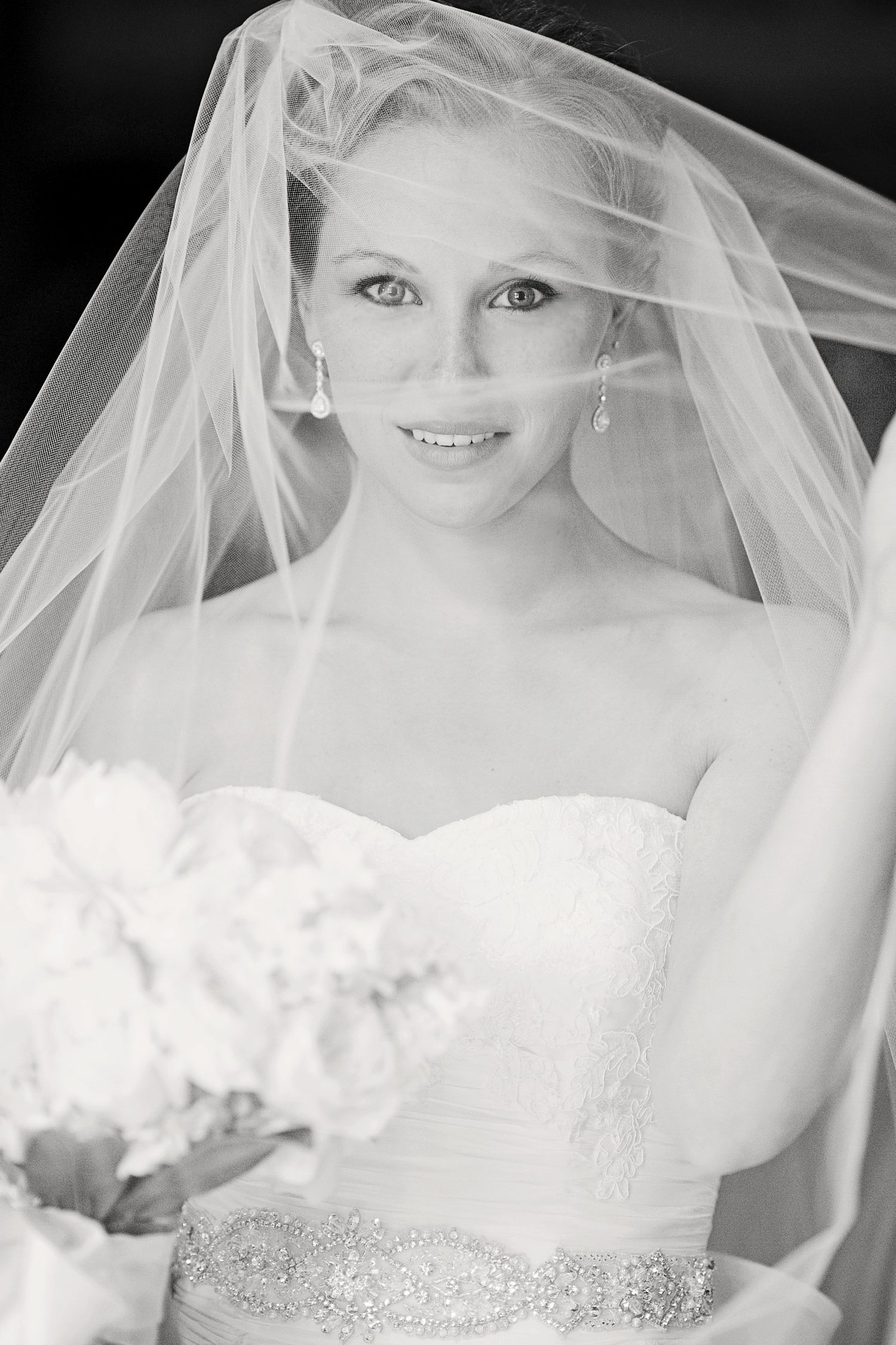 A series of bridal portraits showing a white wedding veil and gown with crystal embellishments in soft lighting.