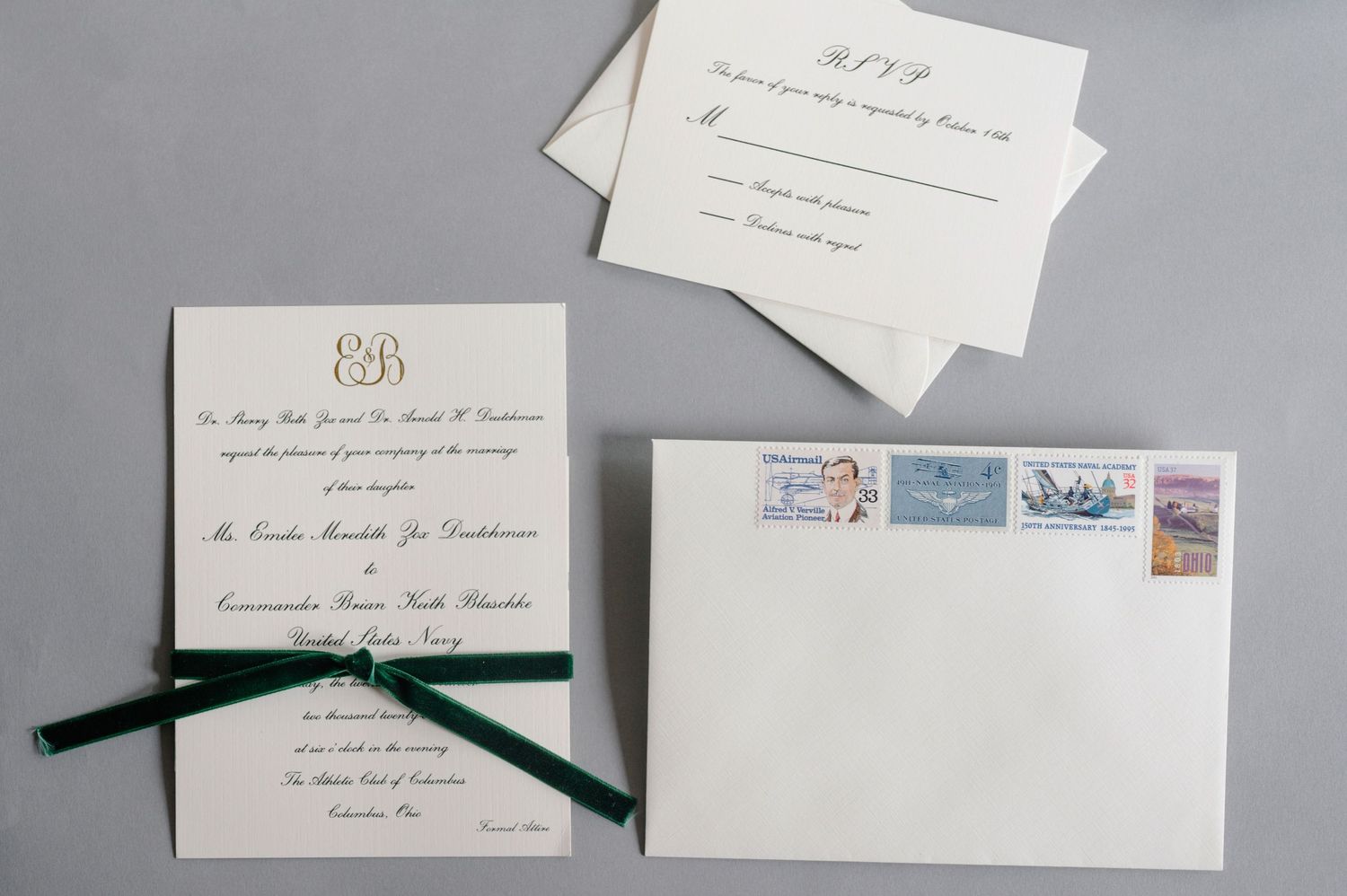 Wedding stationery set with dark green velvet ribbon and matching envelope.