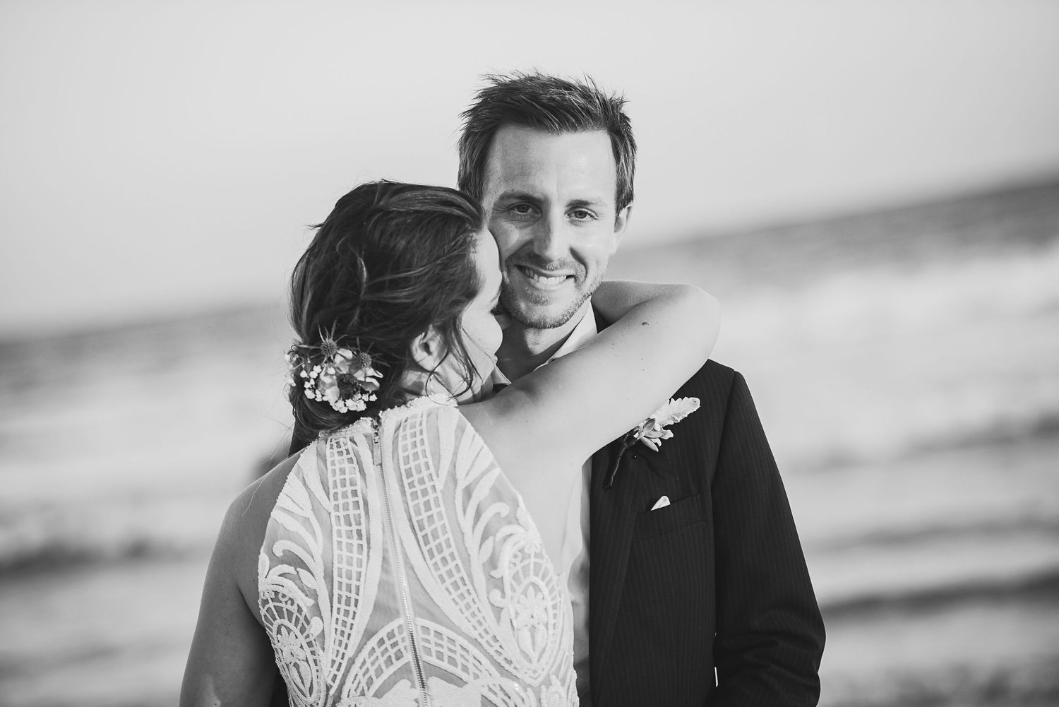 Black and white romantic wedding portraits on the beach.