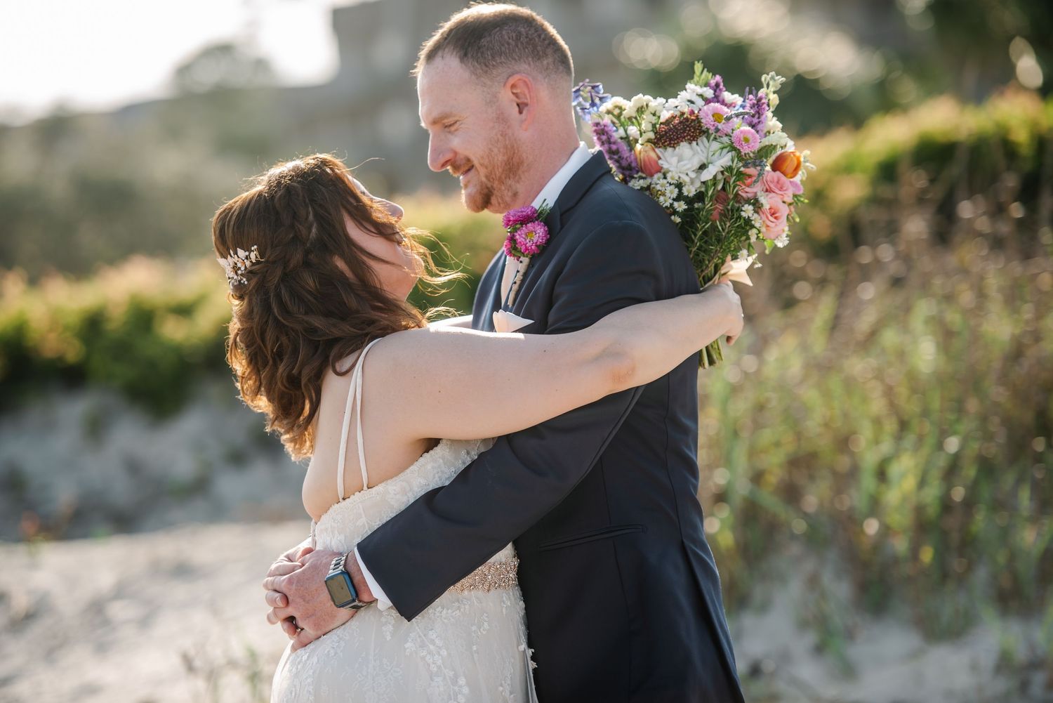 Intimate wedding couple portraits against a sandy beach backdrop during golden hour.Hilton Head