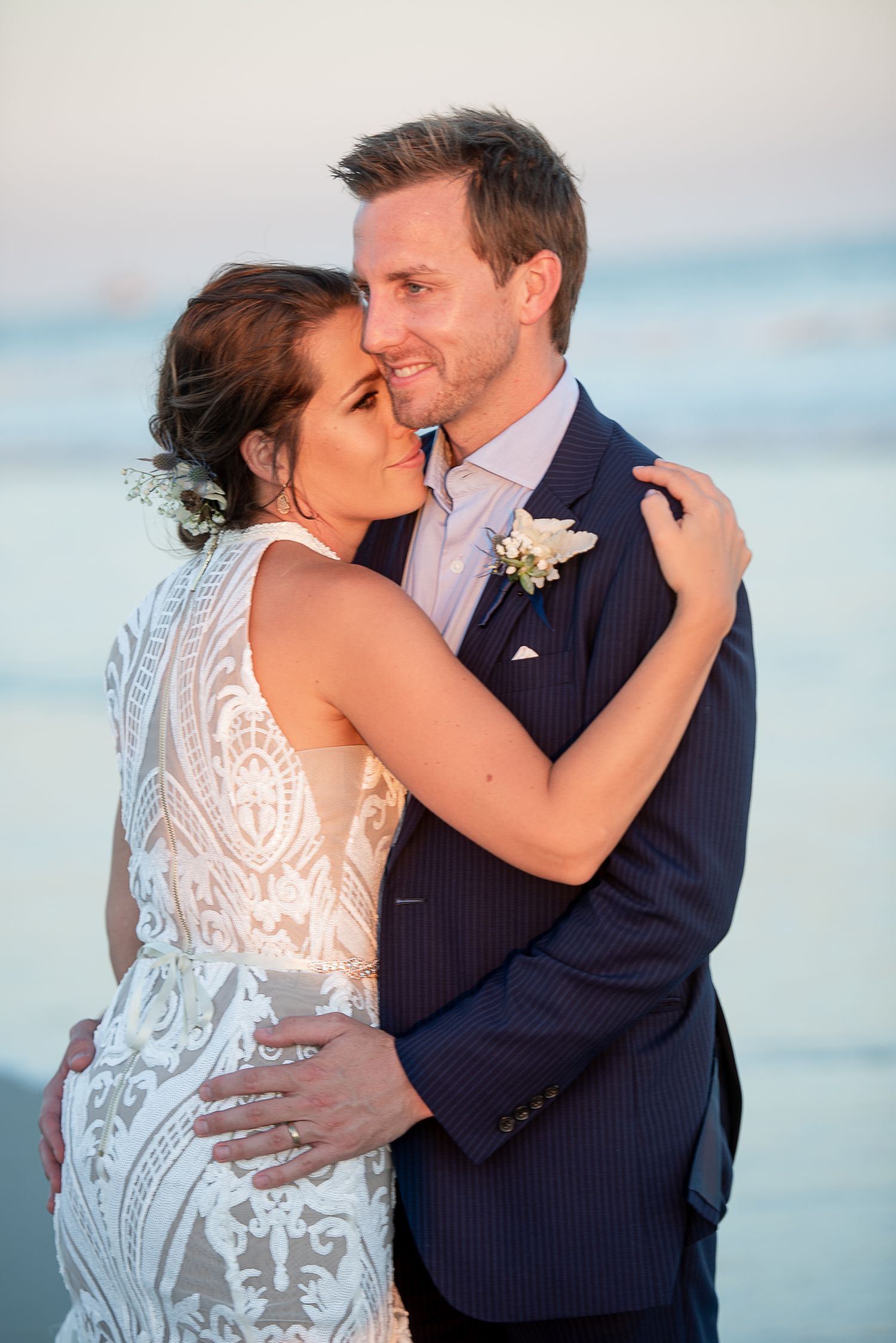 Intimate beachside wedding portraits with ocean backdrop. Hammock Beach engagement session.