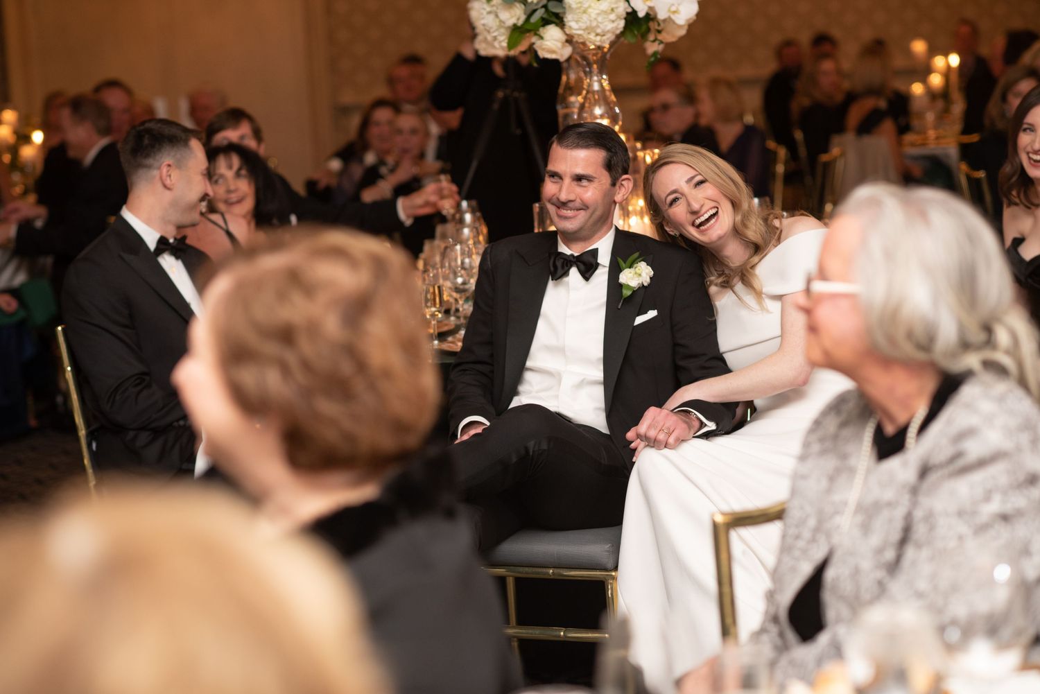 Wedding reception scene in an elegant ballroom with crystal chandeliers and formal attire. Athletic Club, Columbus, OH