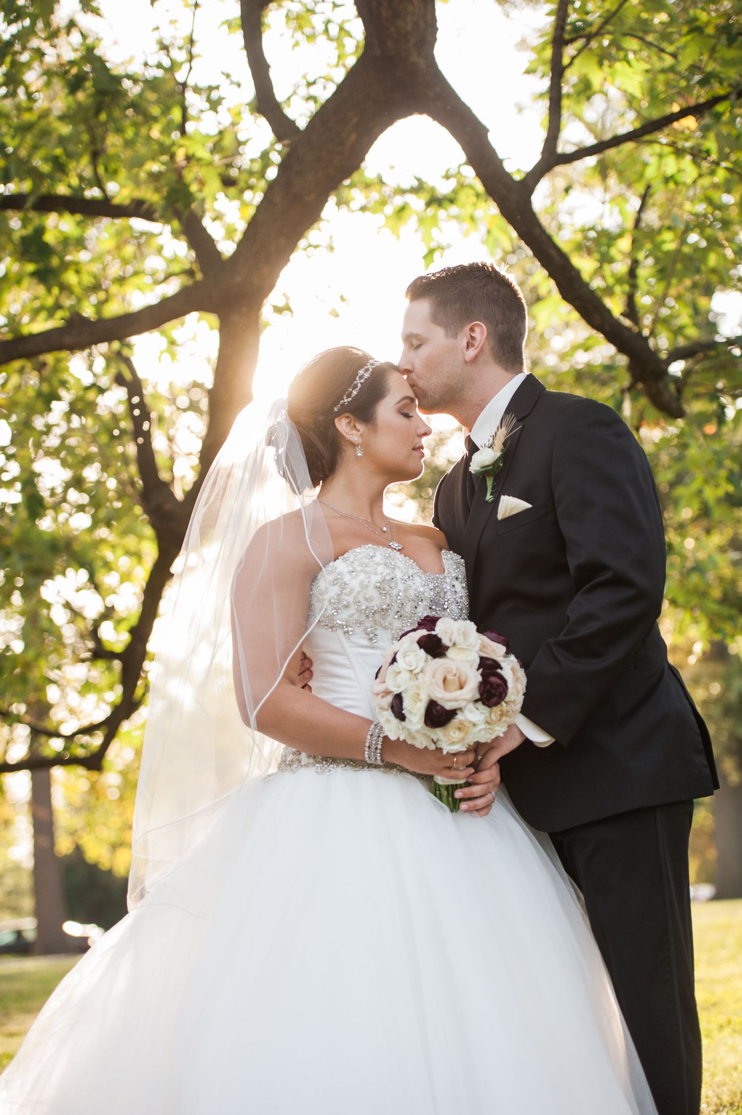 A series of romantic wedding photos showing a couple sharing intimate moments outdoors under sunlit trees.