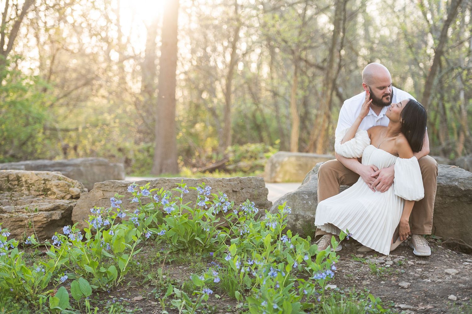 Romantic photoshoot in a wooded area with spring wildflowers blooming in the background. Hammock Beach engagement session.