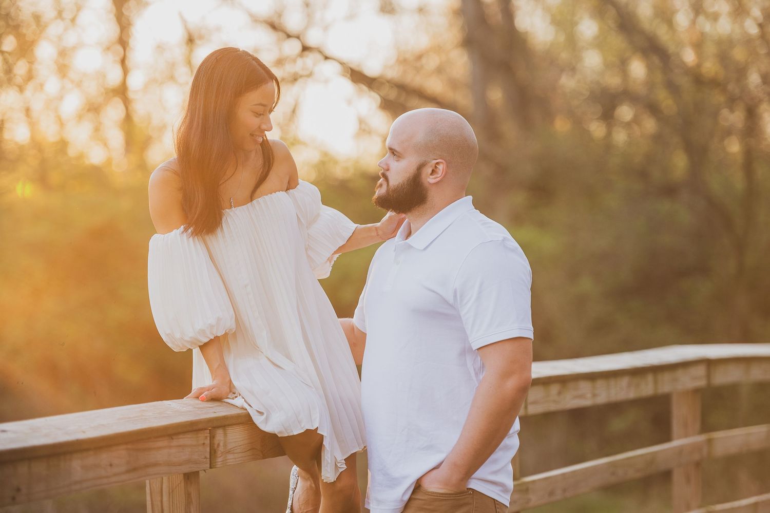 Golden hour engagement photos on wooden bridge with romantic poses. Palm Coast, St. Augustine engagement photographer.