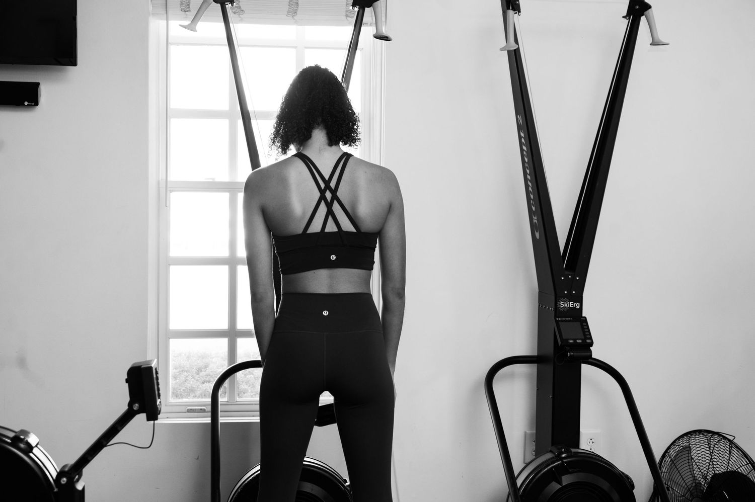 Exercise equipment and workout machines in a bright, modern fitness facility.