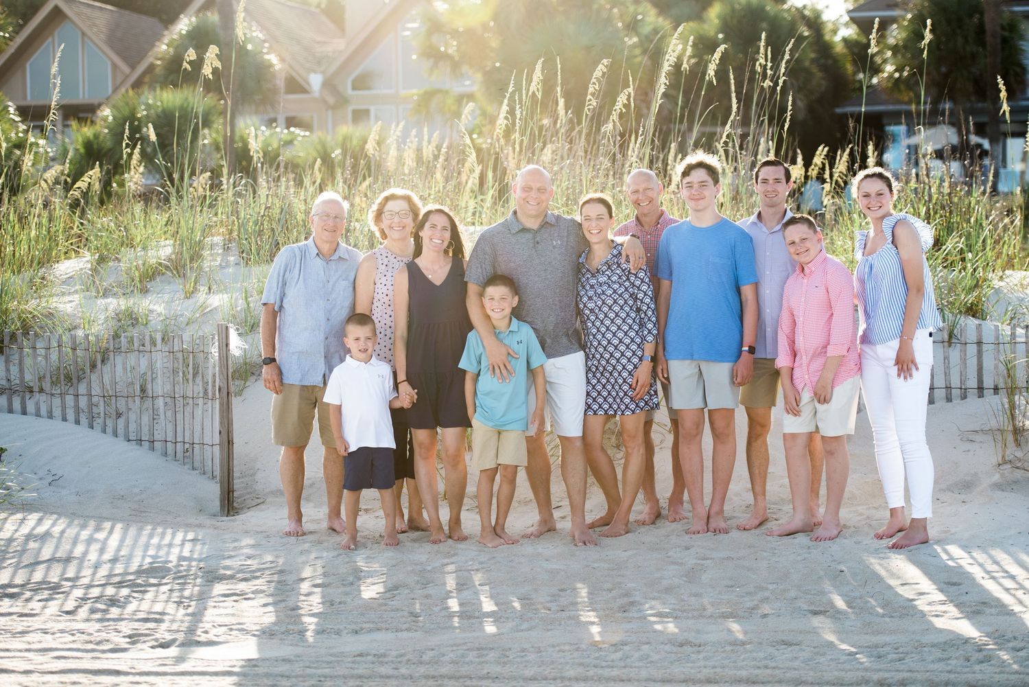 Beachside family portrait with natural dune landscape and golden sunlight.Hammock Beach, Sea Pines coastal photography.