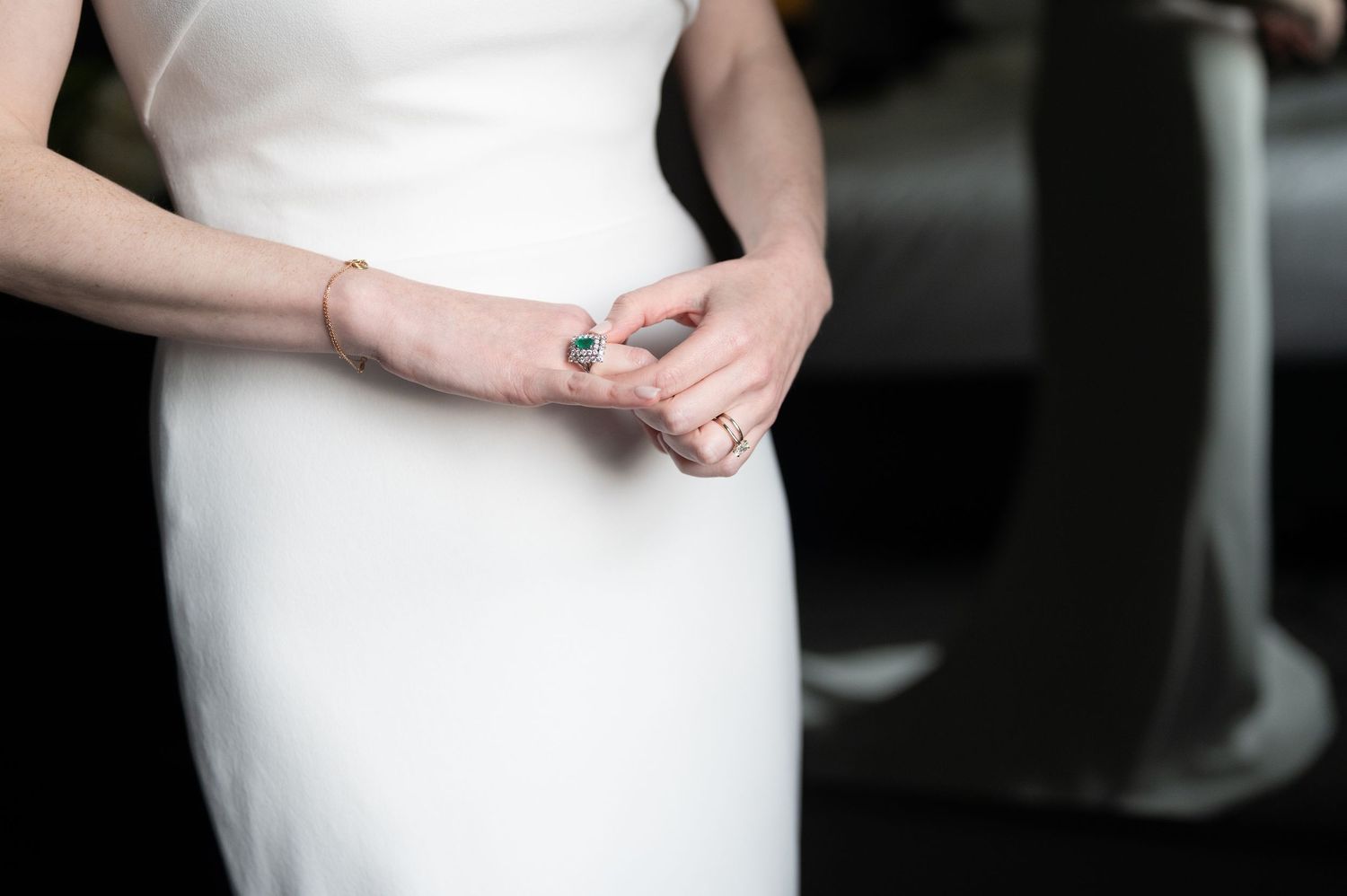 Close-up detail of a sleek white wedding dress.