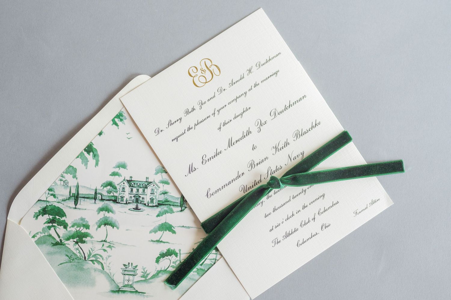 Elegant wedding invitation suite with green toile pattern and emerald ribbon accent.