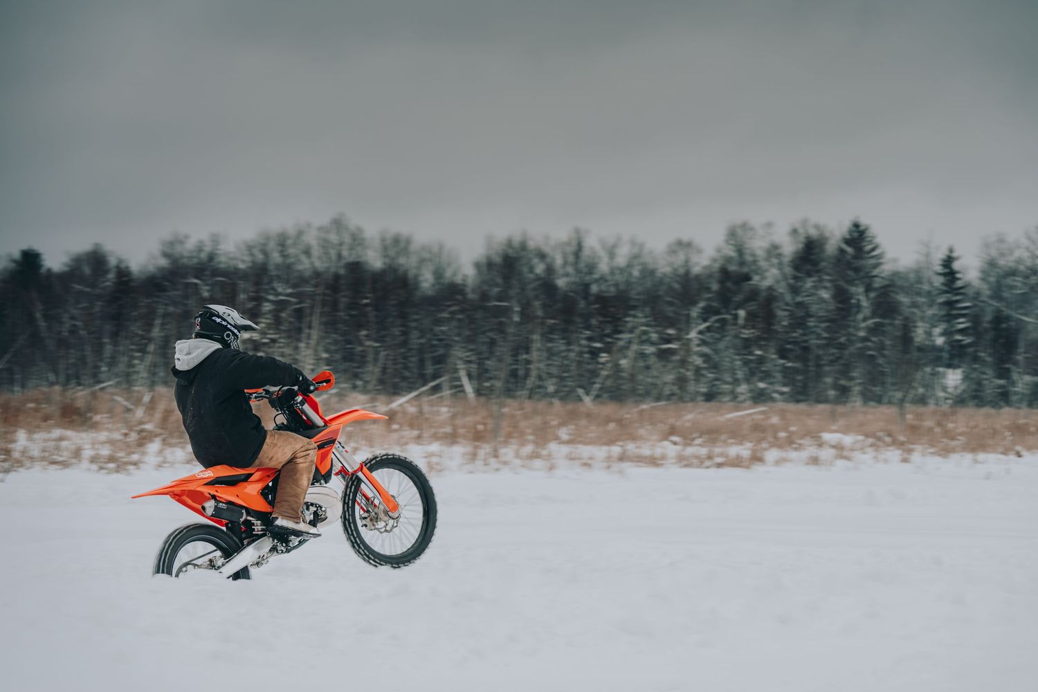 dirt biker on ice doing wheelie in the winter | Tweed Ontario | Yesterday's Focus