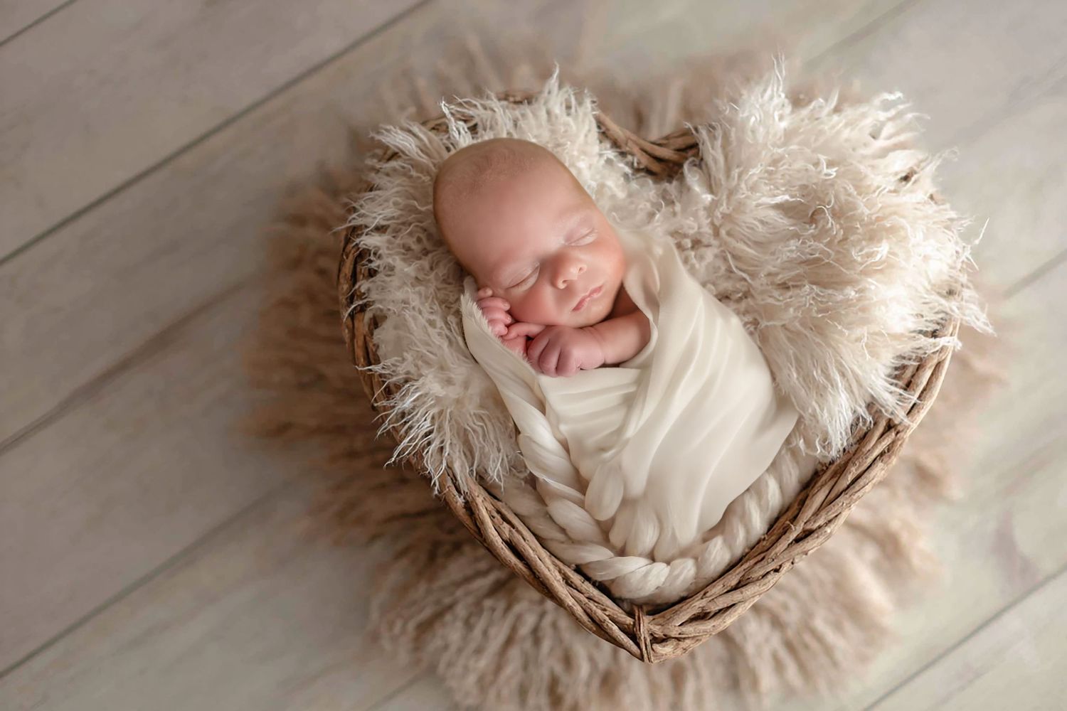 newborn in heart basket during newborn session in Madoc, Ontario | Yesterday's Focus