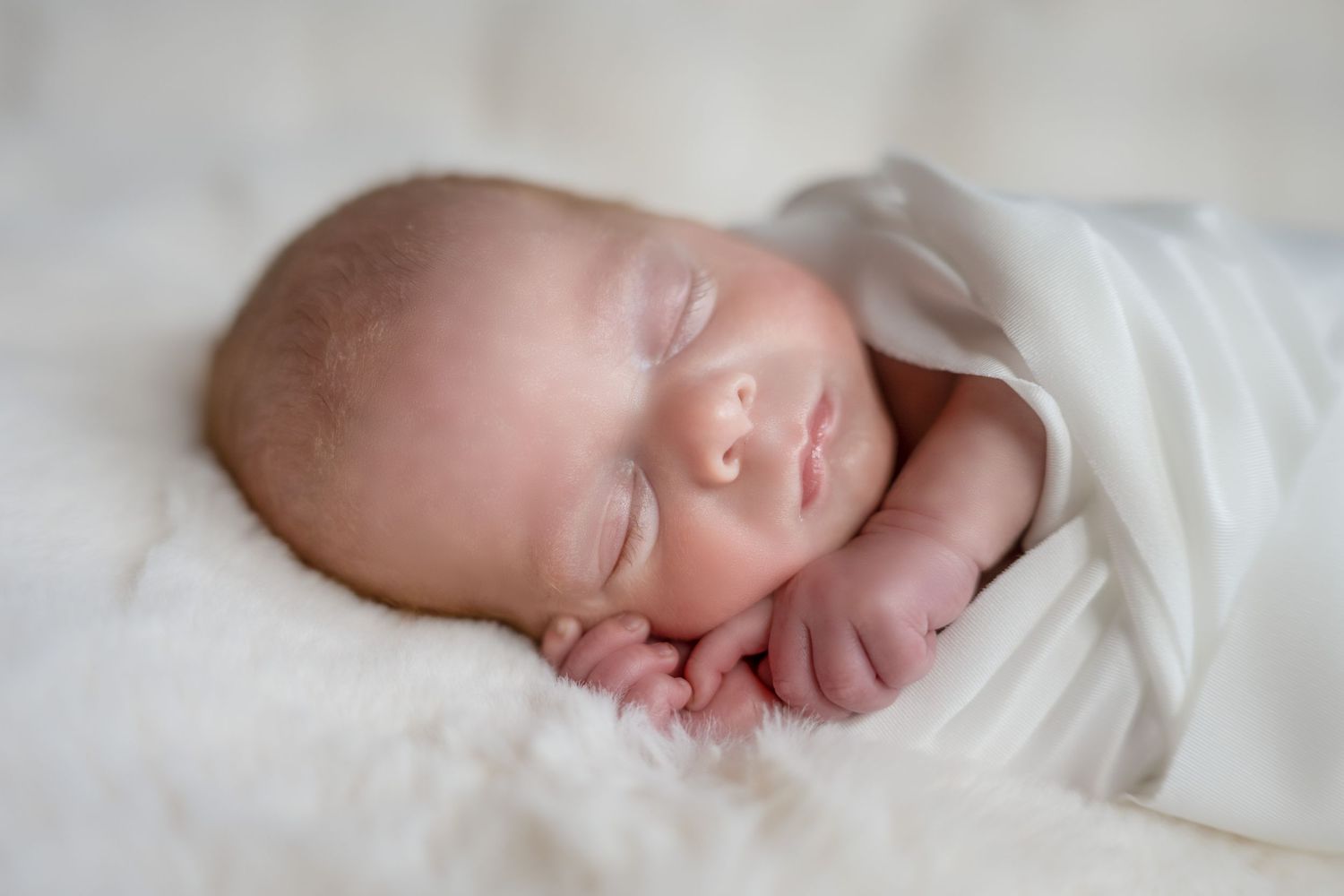 newborn sleeping in white during newborn session in Havelock Ontario | Yesterday's Focus