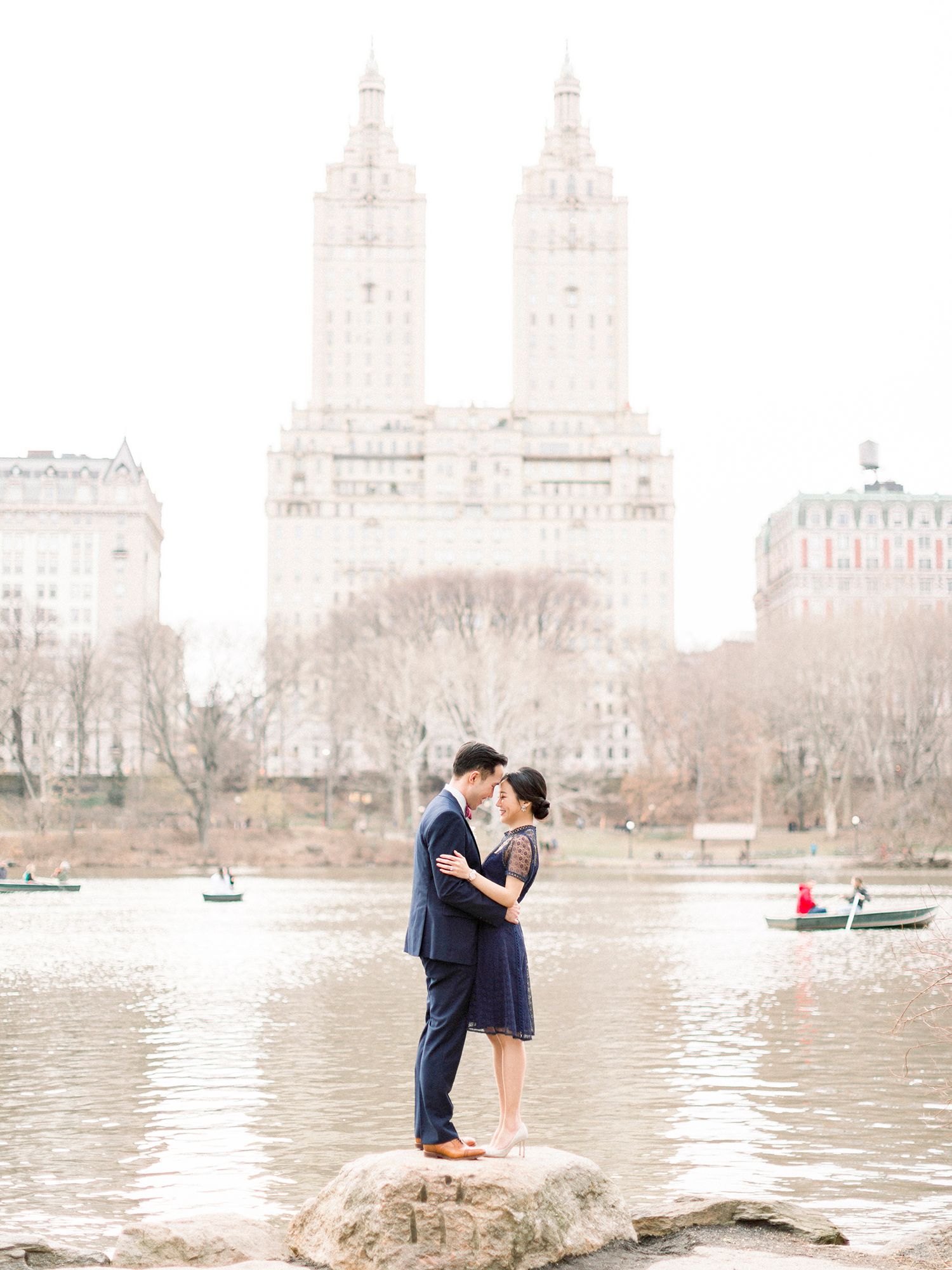 A romantic moment by the Central Park lake with the San Remo towers in the background.