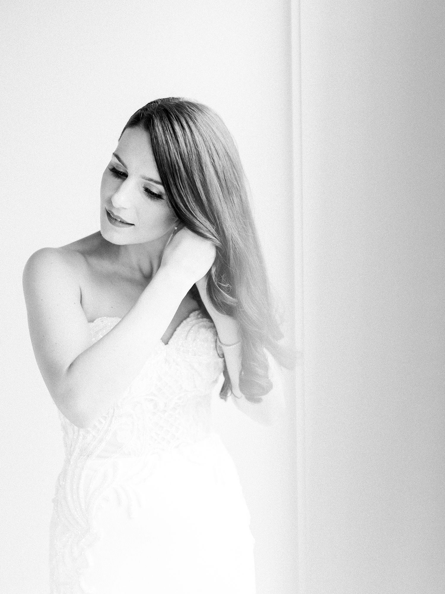 Ethereal bridal portraits in soft white tones against a light background.