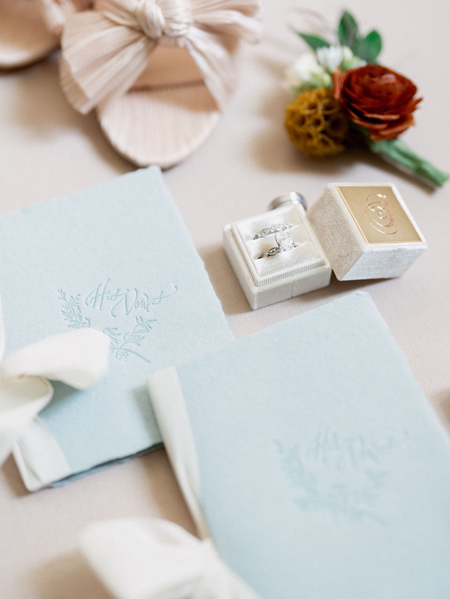 Light blue wedding stationery suite with delicate floral details and gold accents.