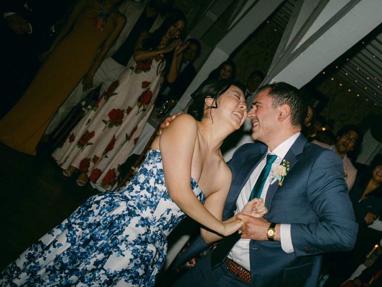 Romantic wedding couple sharing intimate moments during their reception celebration.