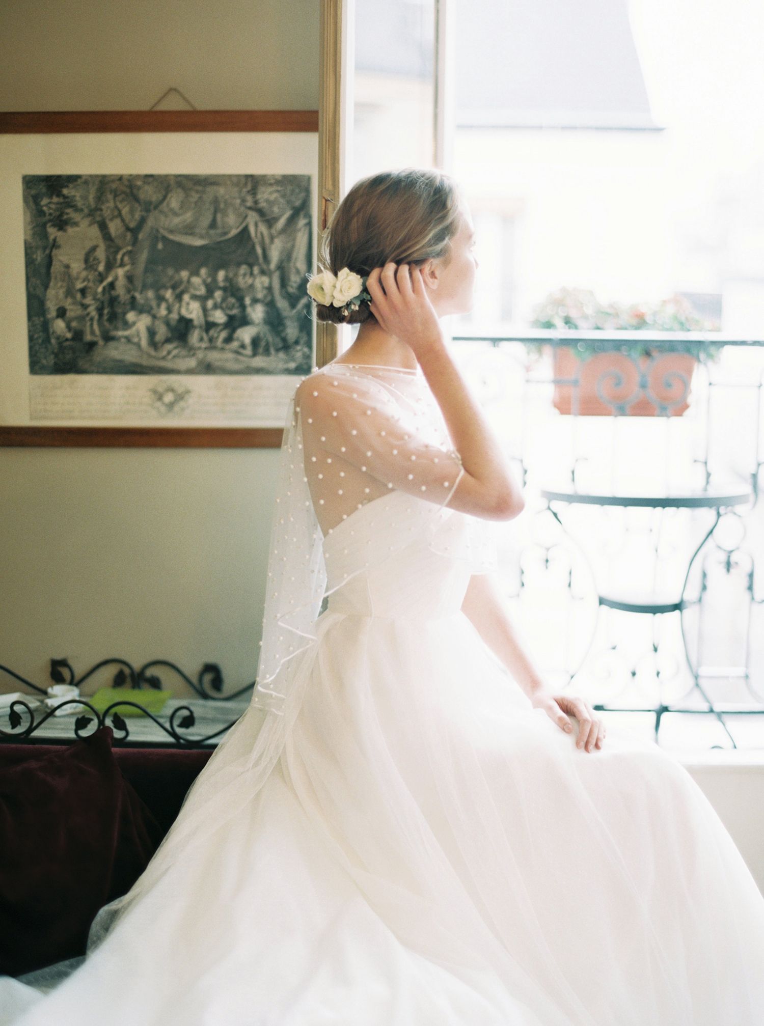 Elegant white ballgown wedding dress with sparkly details twirling in natural light.