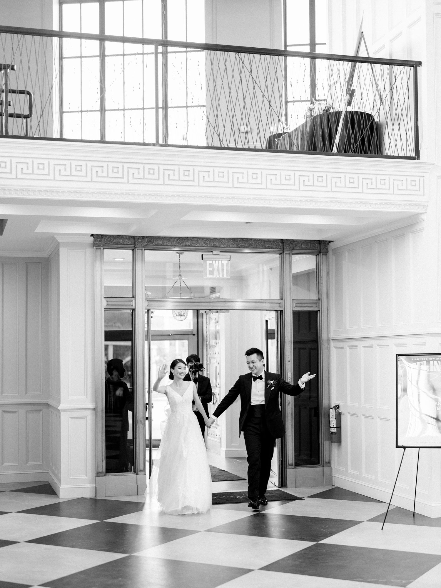 Wedding sequence showing couple's grand entrance in an elegant white ballroom.