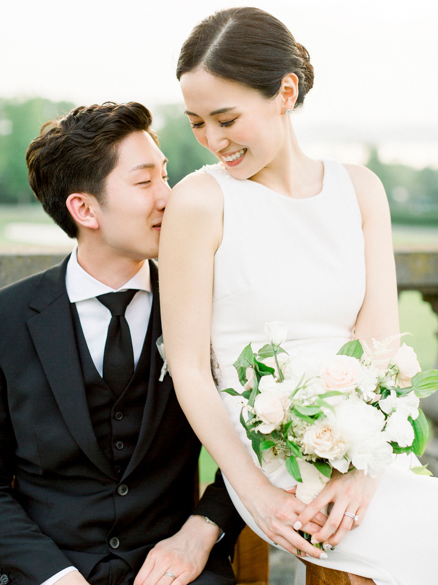 Intimate wedding couple moments captured in a series of tender outdoor portraits.