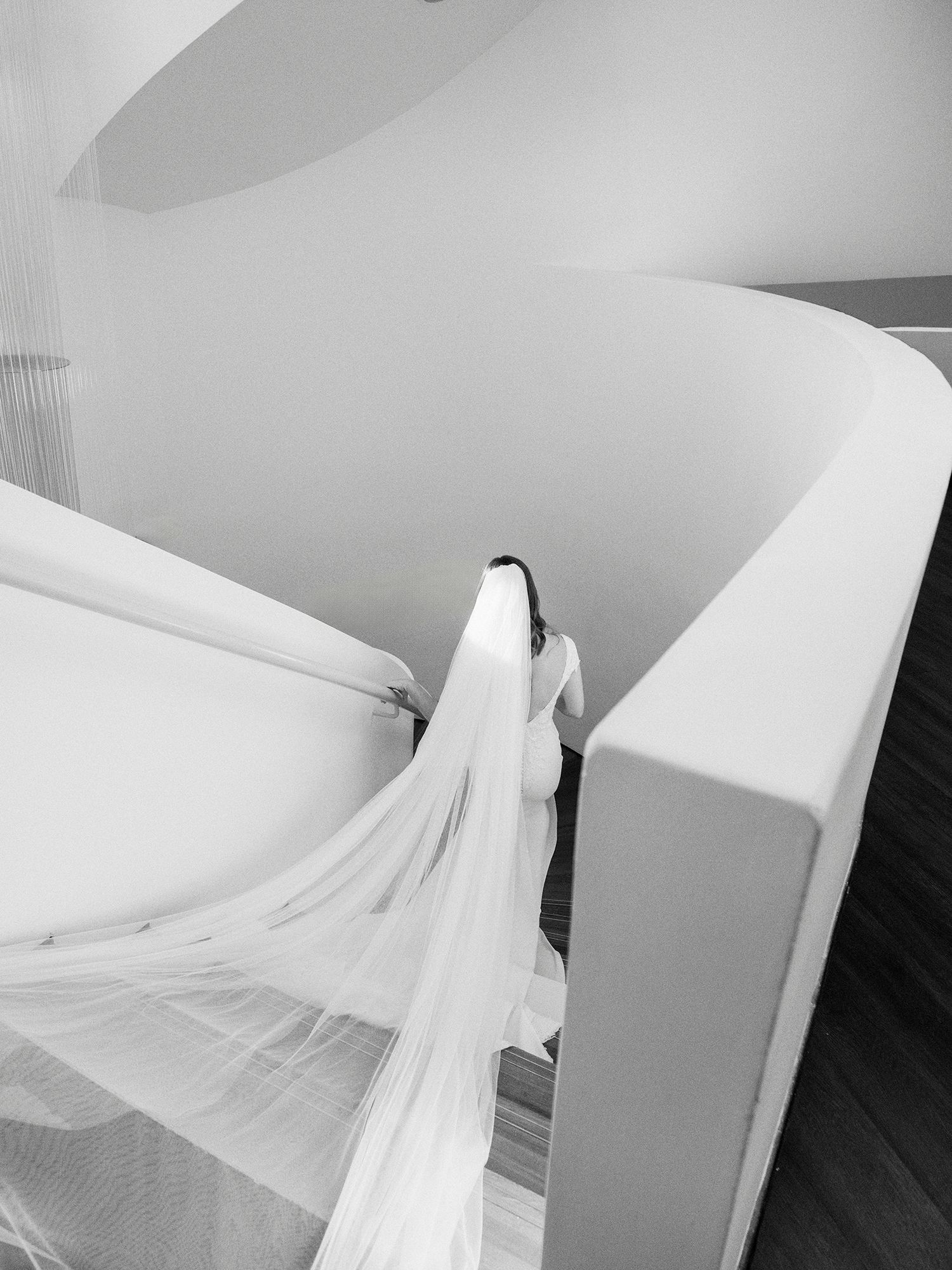 Flowing white fabric draped elegantly across minimalist furniture in monochrome. NJ Wedding photographer.