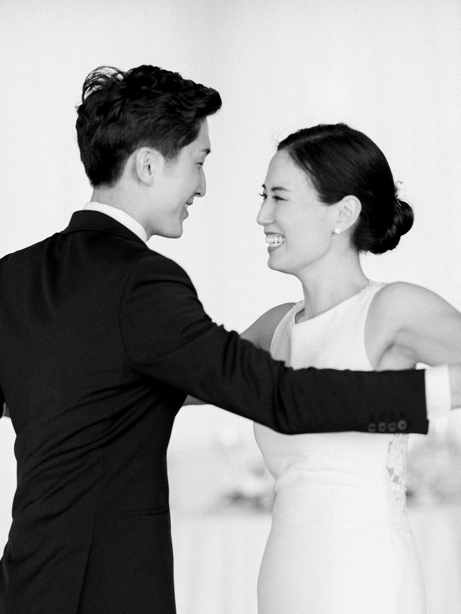 Black and white photo sequence capturing joyful dance movements at a wedding.