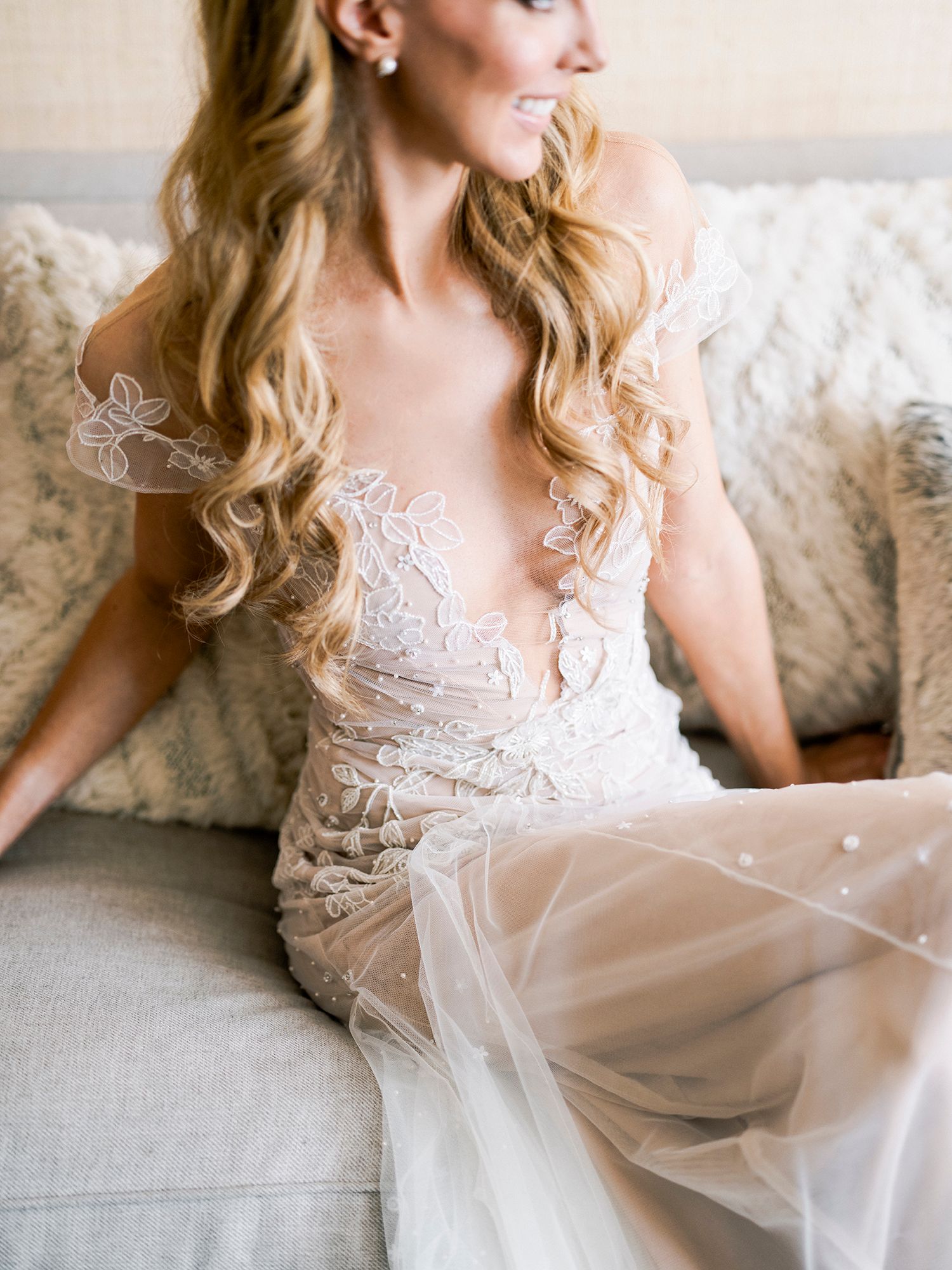 Ethereal bridal portrait featuring delicate lace details and soft tulle fabric.