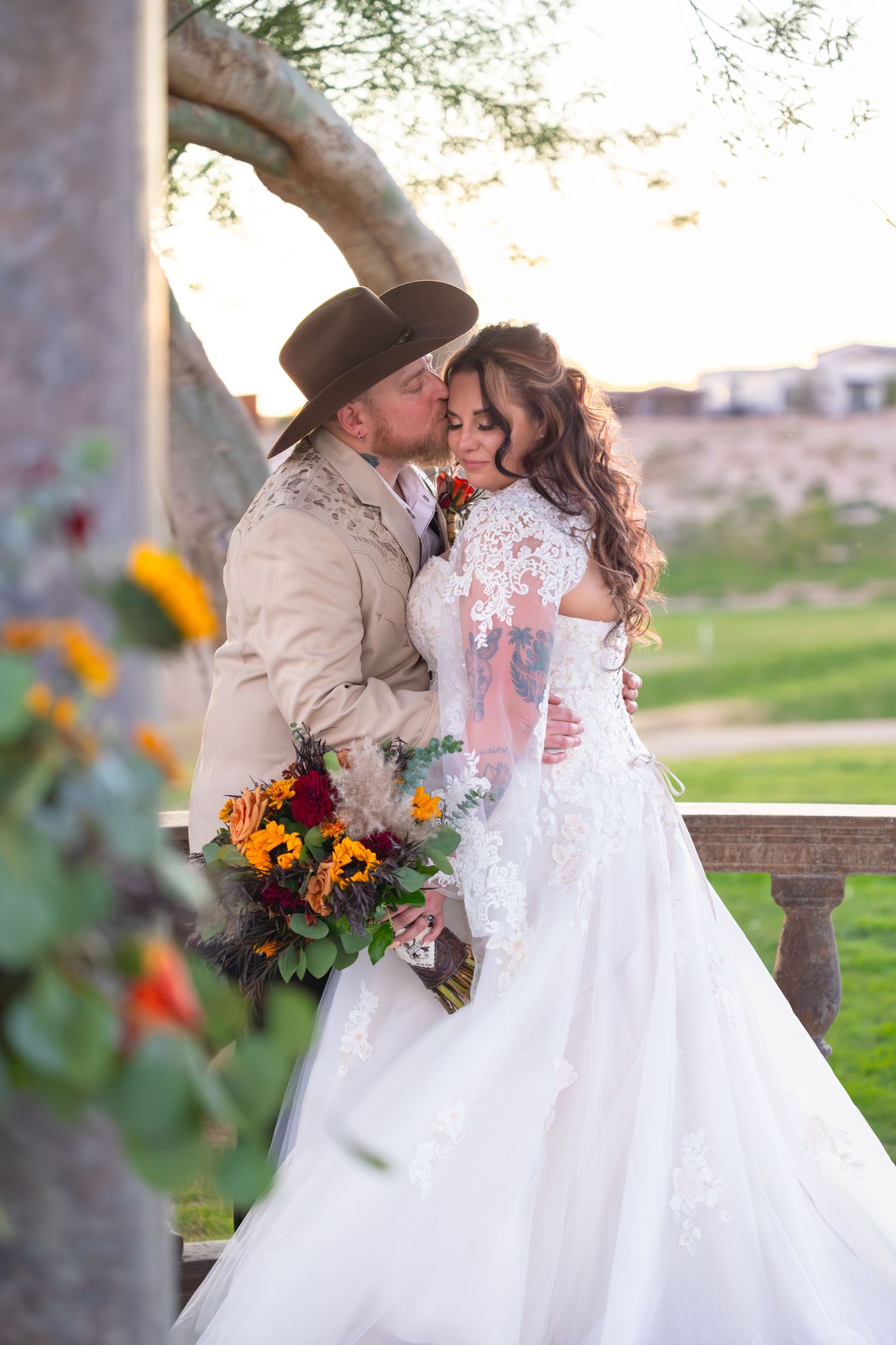 Romantic wedding couple portrait with sunflowers and lace dress at iron wolf lake havasu city arizona.