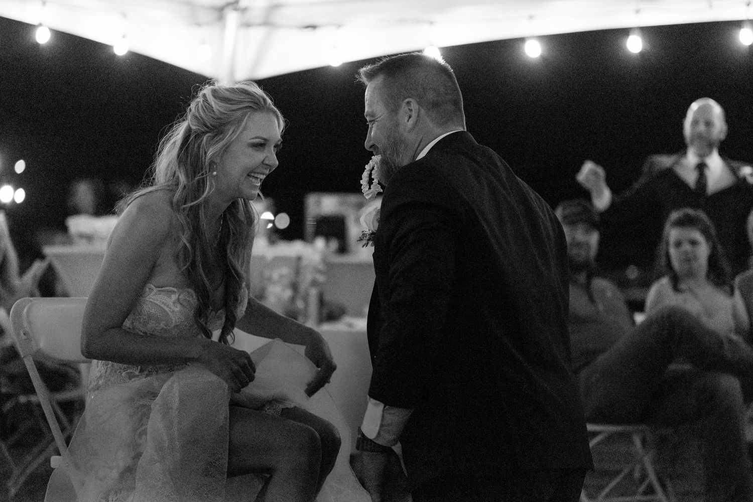 Black and white wedding reception photos show couples dancing and celebrating on the dance floor in the riviera marina lake havasu