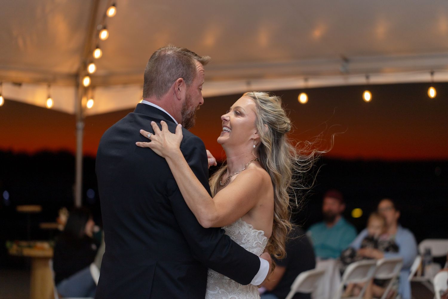 Couple's intimate dance at wedding reception with string lights, The Riviera Marina, Lake Havasu City.